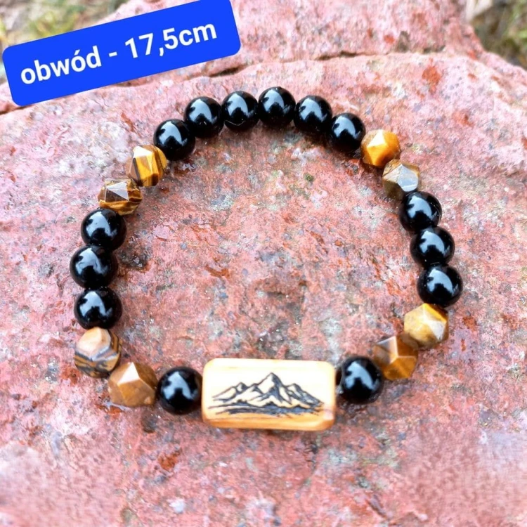 Bransoletka damska z tygrysiego oka, onyksu i drewna oliwnego z grawerem gór.  Obwód bransoletki - 17,5cm mierzony po wewnętrznej stronie